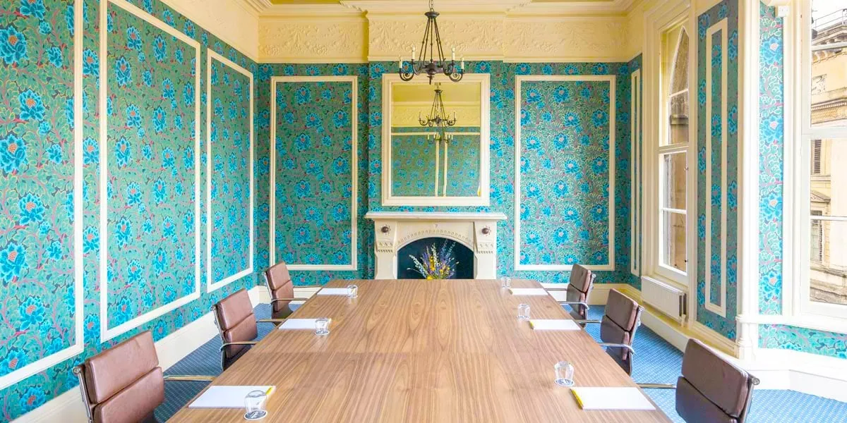 Worcester Room at The Randolph Hotel Oxford, a private investor presentation room overlooking the Ashmolean Museum, configured for boardroom-style meetings and hospitality